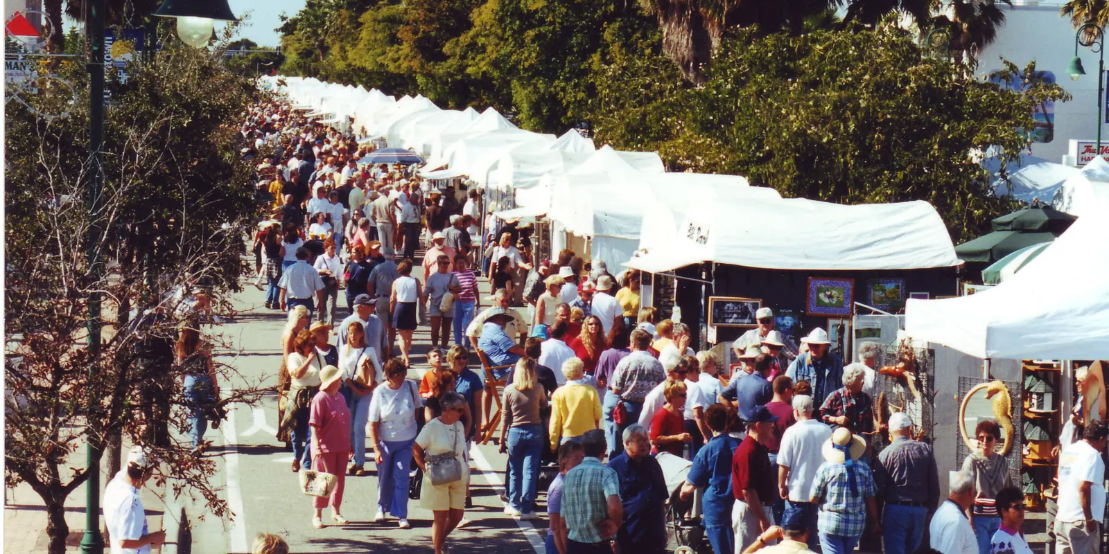 Crowds walking the tented booths at the Cape Coral Art Festival