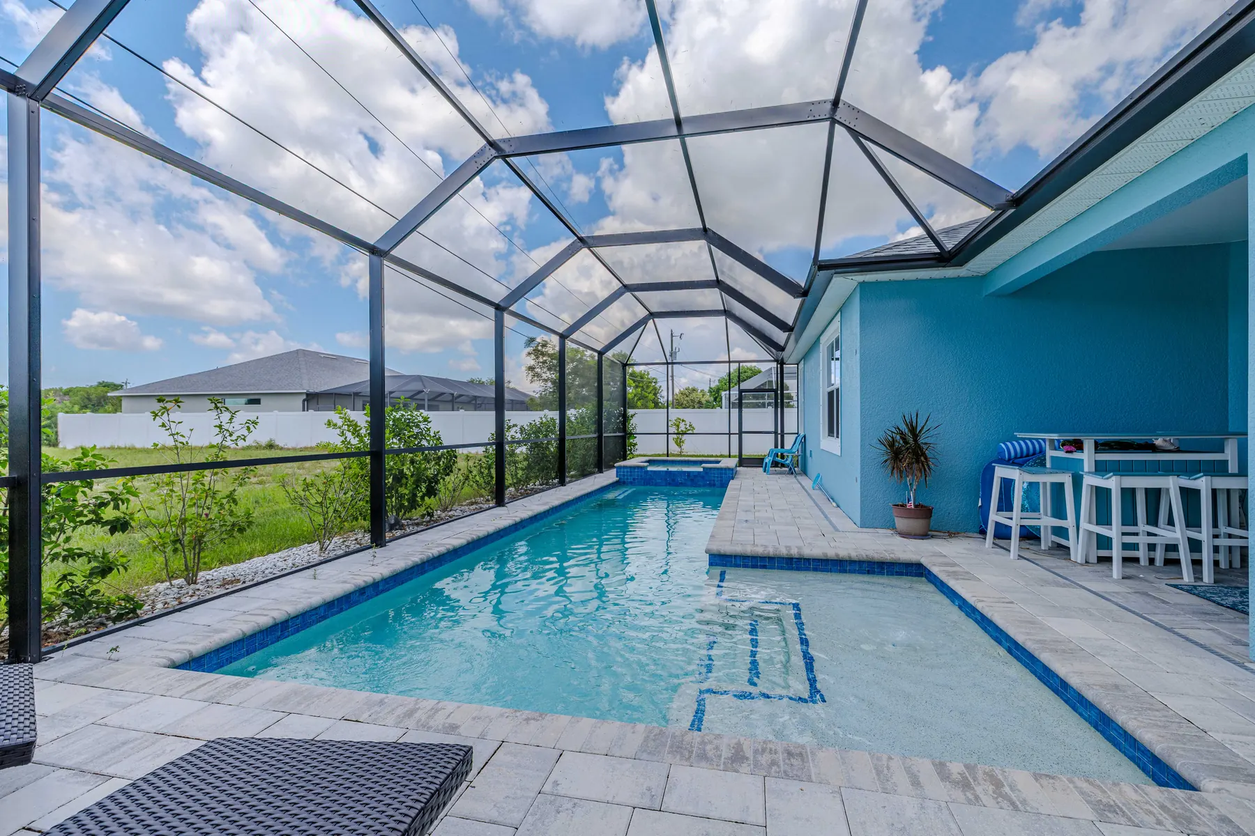 Pool running along the back of the house