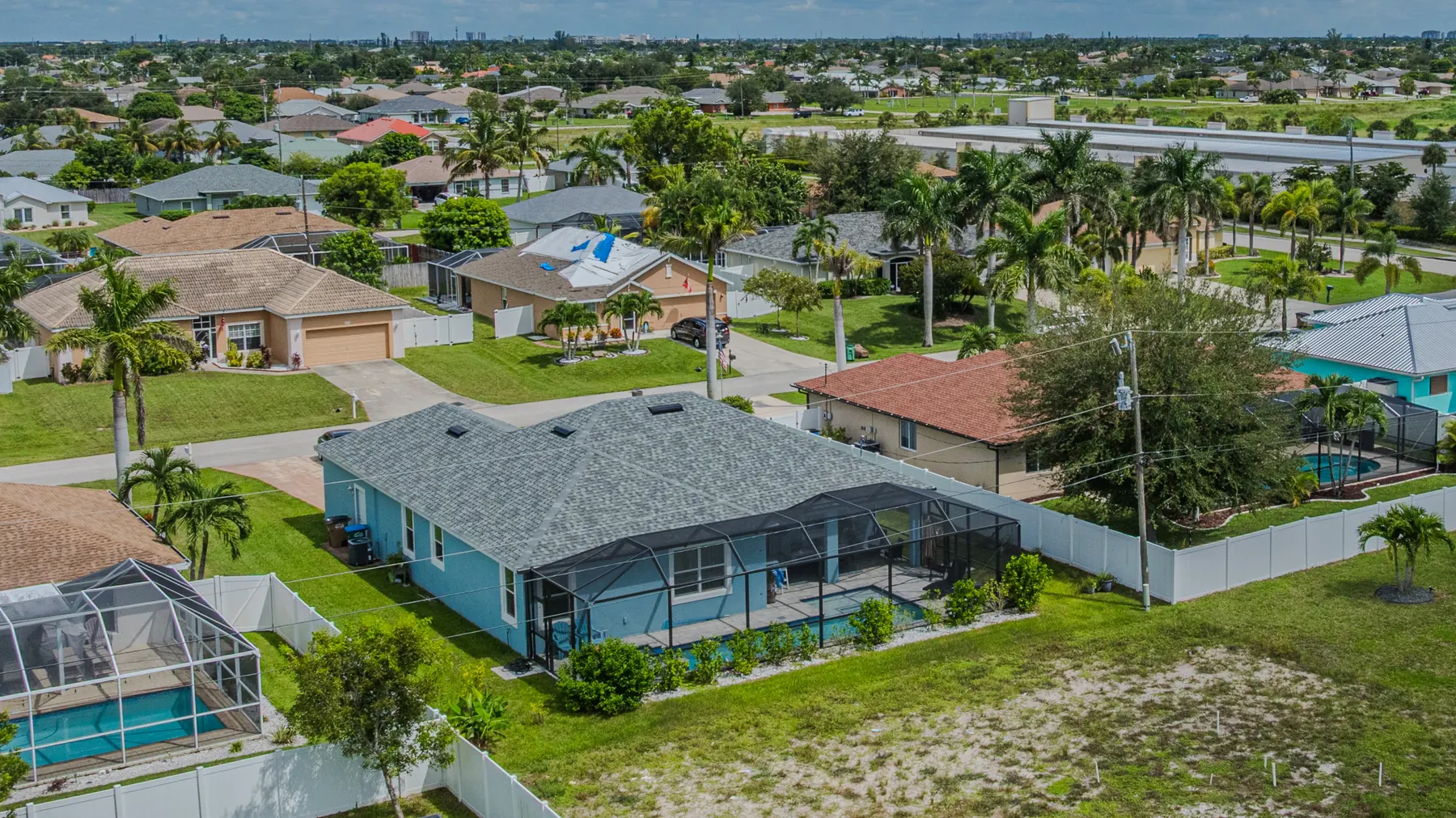 Aerial view of the home and the surrounding neighborhood