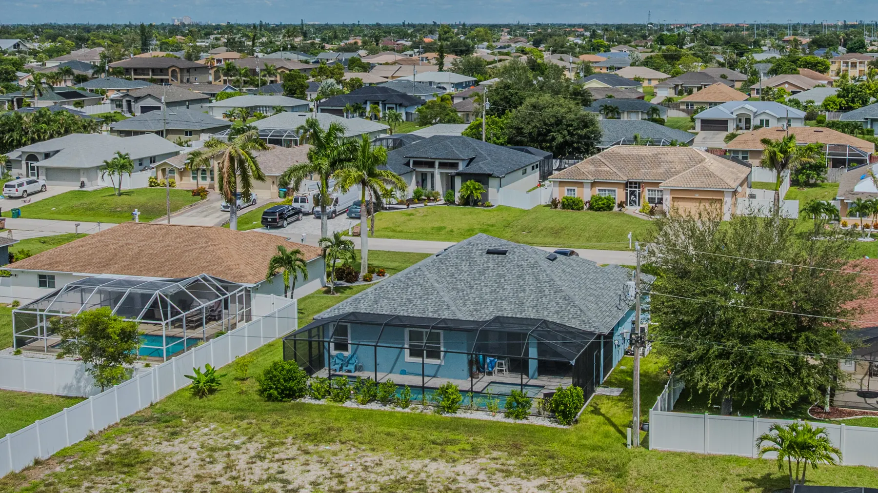 Aerial view of the back yard and pool cage