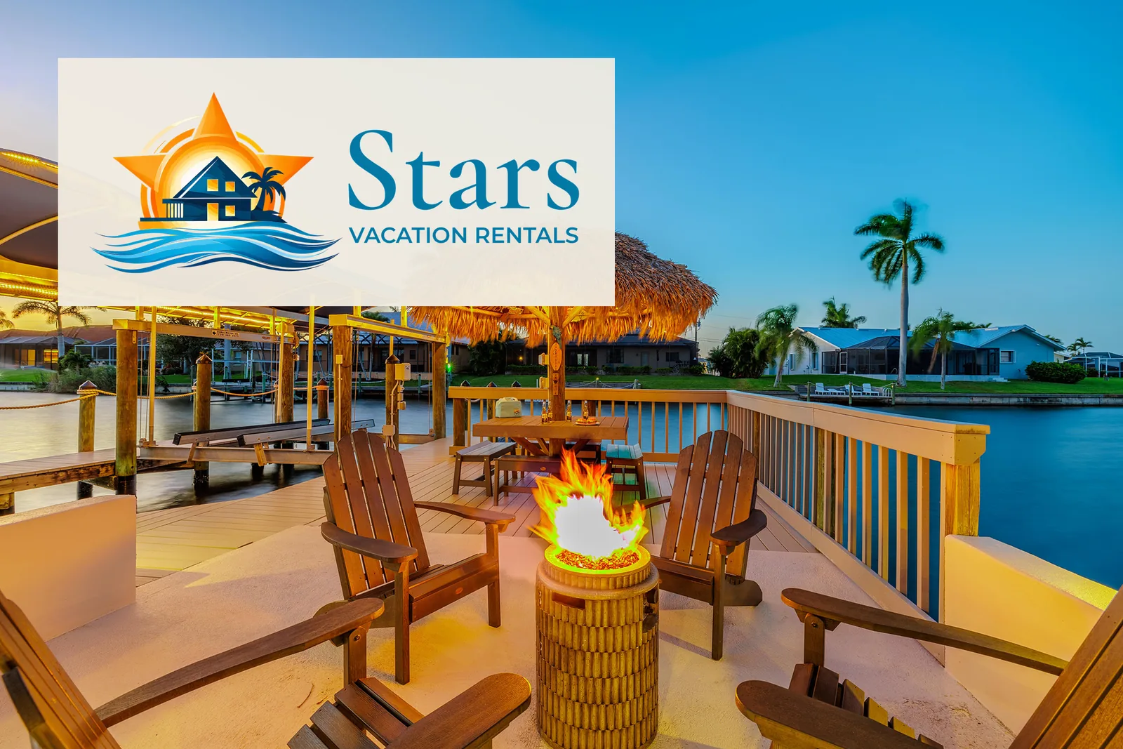 Tiki hut, fire pit and chairs on a Cape Coral canal dock, with the Stars Vacation Rentals logo