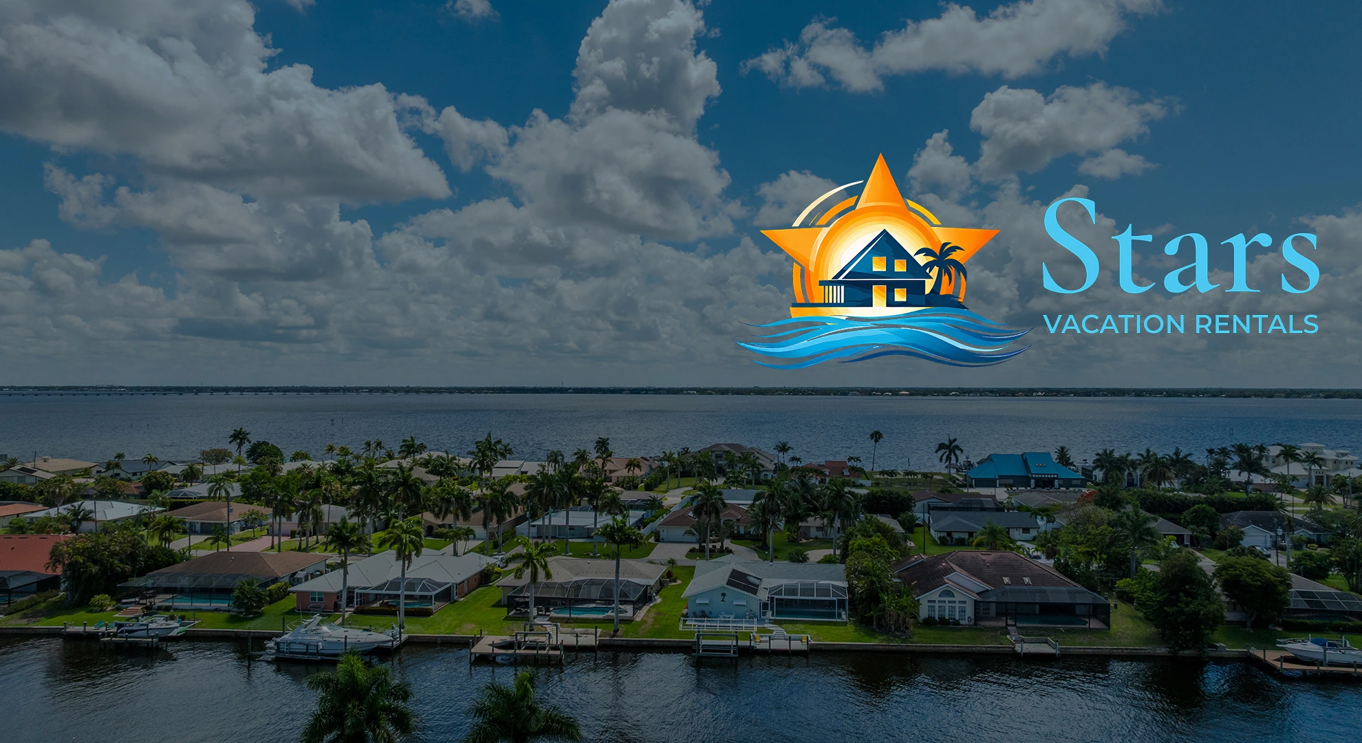 Aerial view of canal-front homes in Cape Coral, with the Stars Vacation Rentals logo