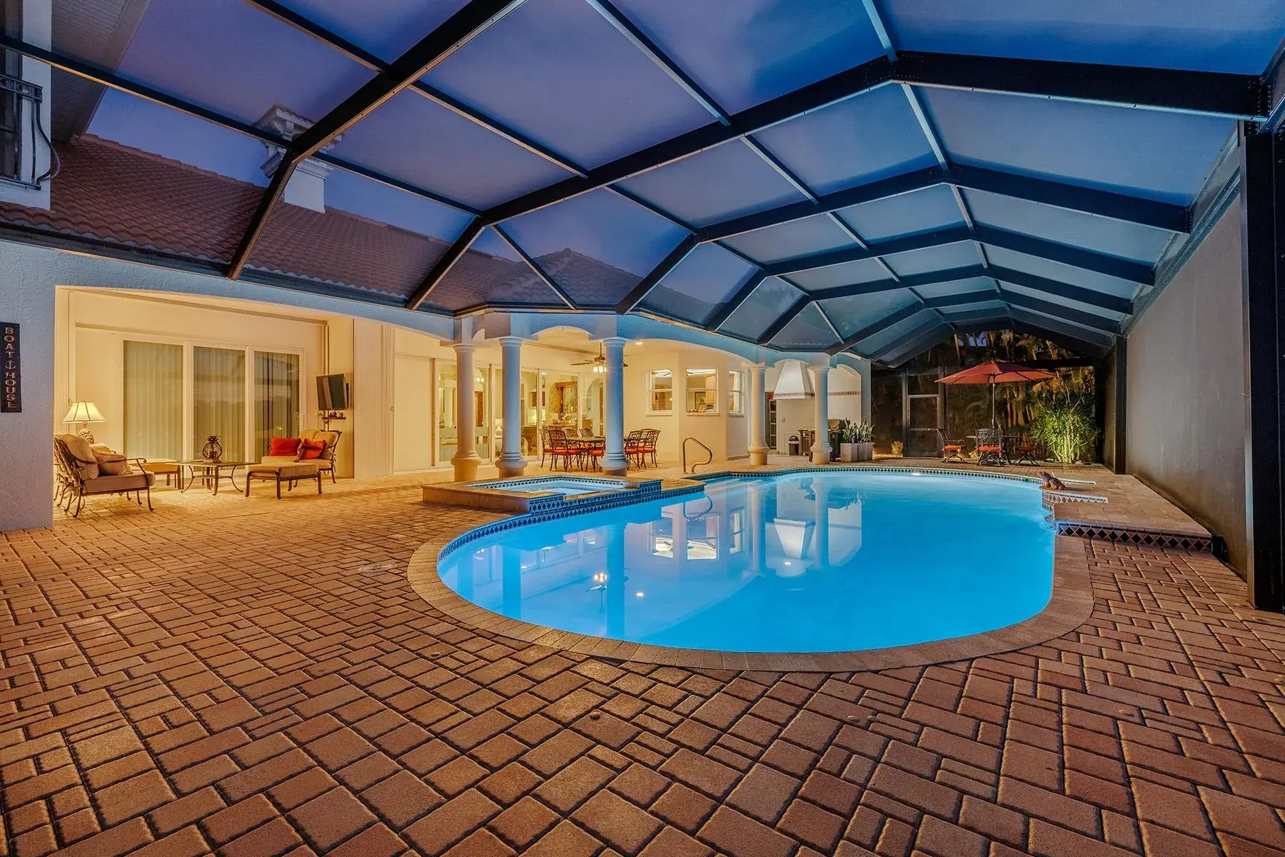 Screened lanai pool at dusk